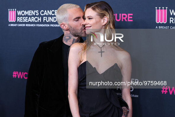 American singer and songwriter Adam Levine of American pop rock band Maroon 5 and wife/Namibian model Behati Prinsloo arrive at The Women's...