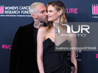 American singer and songwriter Adam Levine of American pop rock band Maroon 5 and wife/Namibian model Behati Prinsloo arrive at The Women's...