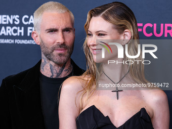 American singer and songwriter Adam Levine of American pop rock band Maroon 5 and wife/Namibian model Behati Prinsloo arrive at The Women's...