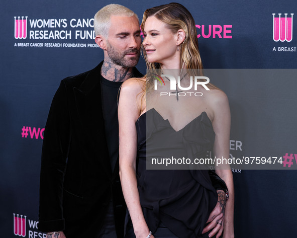 American singer and songwriter Adam Levine of American pop rock band Maroon 5 and wife/Namibian model Behati Prinsloo arrive at The Women's...