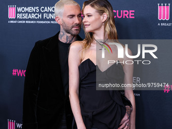 American singer and songwriter Adam Levine of American pop rock band Maroon 5 and wife/Namibian model Behati Prinsloo arrive at The Women's...