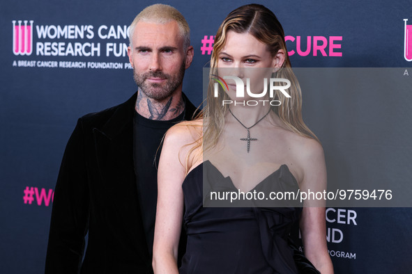 American singer and songwriter Adam Levine of American pop rock band Maroon 5 and wife/Namibian model Behati Prinsloo arrive at The Women's...