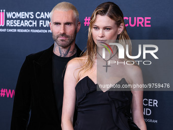 American singer and songwriter Adam Levine of American pop rock band Maroon 5 and wife/Namibian model Behati Prinsloo arrive at The Women's...