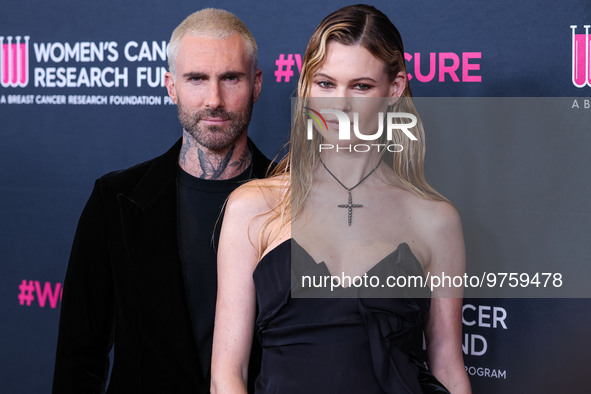 American singer and songwriter Adam Levine of American pop rock band Maroon 5 and wife/Namibian model Behati Prinsloo arrive at The Women's...