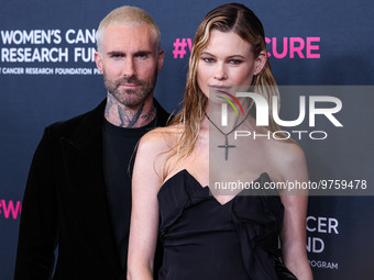 American singer and songwriter Adam Levine of American pop rock band Maroon 5 and wife/Namibian model Behati Prinsloo arrive at The Women's...