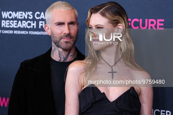 American singer and songwriter Adam Levine of American pop rock band Maroon 5 and wife/Namibian model Behati Prinsloo arrive at The Women's...