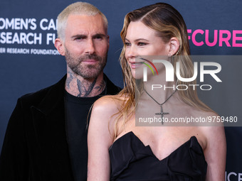 American singer and songwriter Adam Levine of American pop rock band Maroon 5 and wife/Namibian model Behati Prinsloo arrive at The Women's...