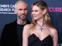 American singer and songwriter Adam Levine of American pop rock band Maroon 5 and wife/Namibian model Behati Prinsloo arrive at The Women's...