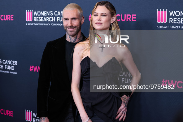 American singer and songwriter Adam Levine of American pop rock band Maroon 5 and wife/Namibian model Behati Prinsloo arrive at The Women's...