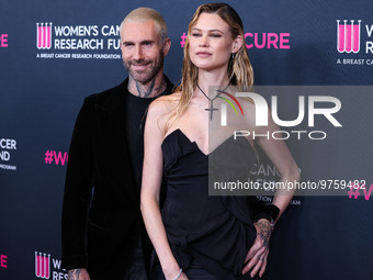 American singer and songwriter Adam Levine of American pop rock band Maroon 5 and wife/Namibian model Behati Prinsloo arrive at The Women's...