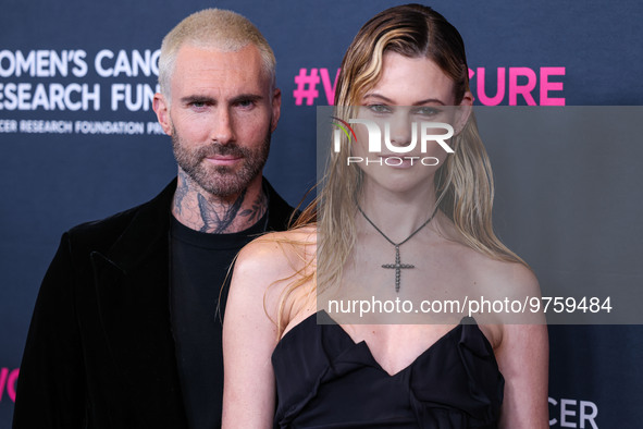 American singer and songwriter Adam Levine of American pop rock band Maroon 5 and wife/Namibian model Behati Prinsloo arrive at The Women's...