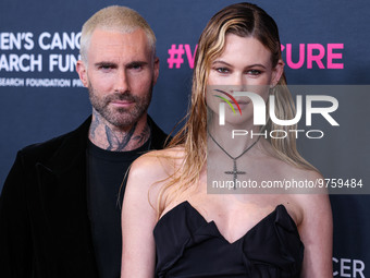 American singer and songwriter Adam Levine of American pop rock band Maroon 5 and wife/Namibian model Behati Prinsloo arrive at The Women's...