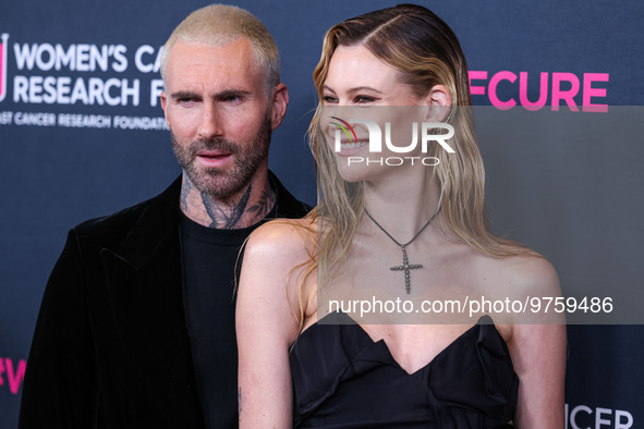 American singer and songwriter Adam Levine of American pop rock band Maroon 5 and wife/Namibian model Behati Prinsloo arrive at The Women's...