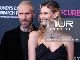 American singer and songwriter Adam Levine of American pop rock band Maroon 5 and wife/Namibian model Behati Prinsloo arrive at The Women's...