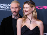 American singer and songwriter Adam Levine of American pop rock band Maroon 5 and wife/Namibian model Behati Prinsloo arrive at The Women's...