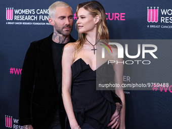 American singer and songwriter Adam Levine of American pop rock band Maroon 5 and wife/Namibian model Behati Prinsloo arrive at The Women's...