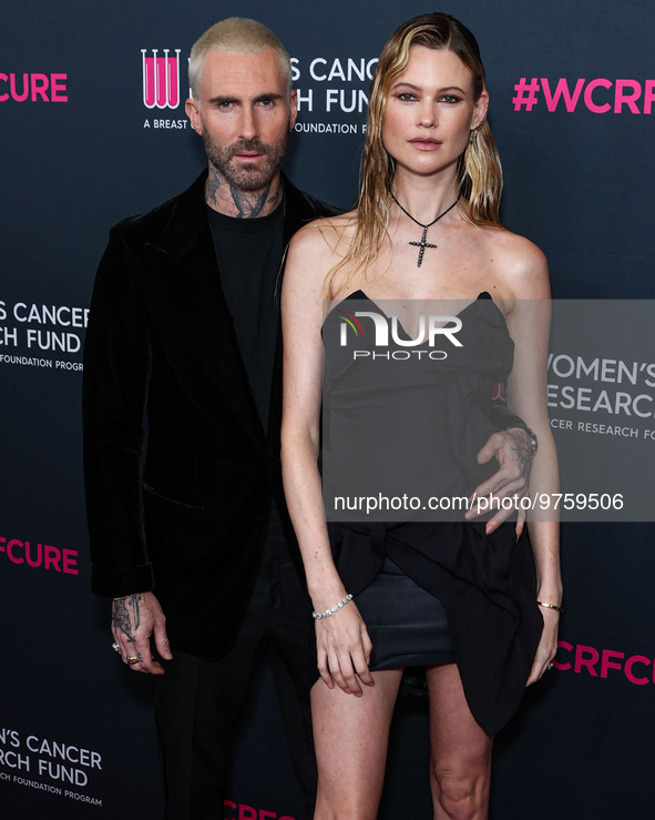 American singer and songwriter Adam Levine of American pop rock band Maroon 5 and wife/Namibian model Behati Prinsloo arrive at The Women's...