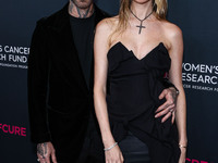 American singer and songwriter Adam Levine of American pop rock band Maroon 5 and wife/Namibian model Behati Prinsloo arrive at The Women's...