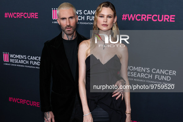 American singer and songwriter Adam Levine of American pop rock band Maroon 5 and wife/Namibian model Behati Prinsloo arrive at The Women's...