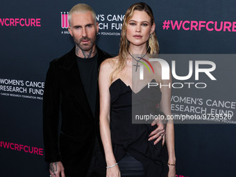 American singer and songwriter Adam Levine of American pop rock band Maroon 5 and wife/Namibian model Behati Prinsloo arrive at The Women's...