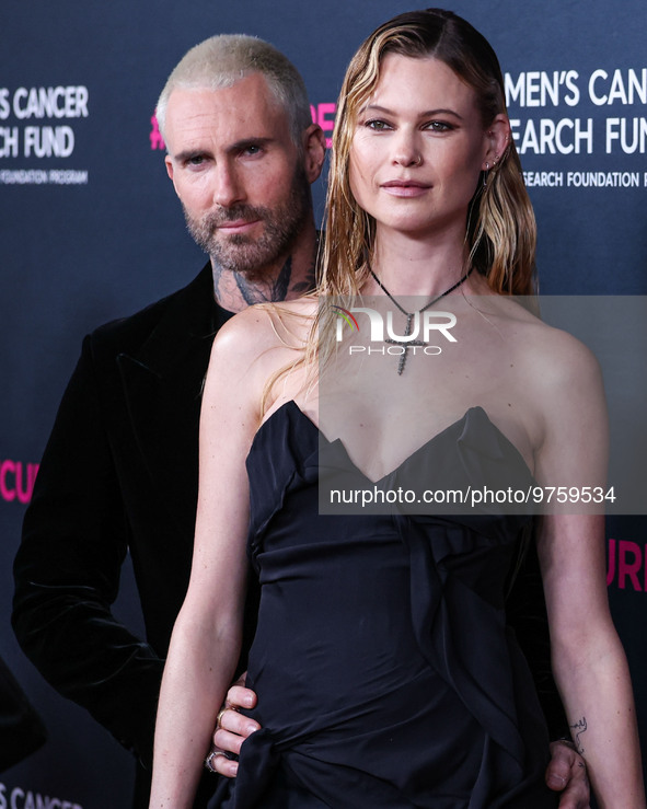 American singer and songwriter Adam Levine of American pop rock band Maroon 5 and wife/Namibian model Behati Prinsloo arrive at The Women's...