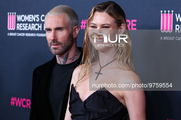 American singer and songwriter Adam Levine of American pop rock band Maroon 5 and wife/Namibian model Behati Prinsloo arrive at The Women's...