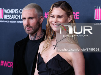 American singer and songwriter Adam Levine of American pop rock band Maroon 5 and wife/Namibian model Behati Prinsloo arrive at The Women's...