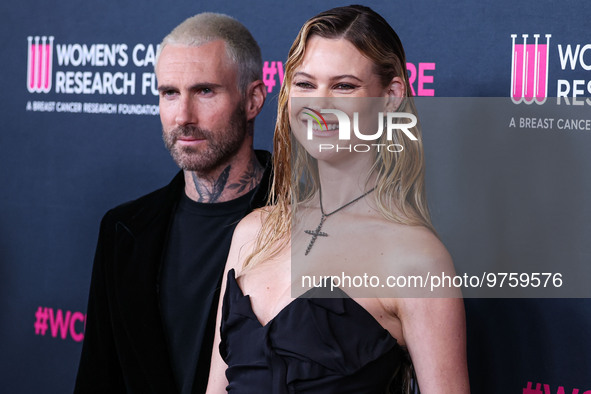 American singer and songwriter Adam Levine of American pop rock band Maroon 5 and wife/Namibian model Behati Prinsloo arrive at The Women's...