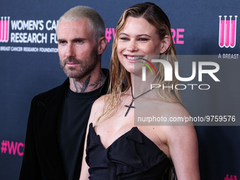 American singer and songwriter Adam Levine of American pop rock band Maroon 5 and wife/Namibian model Behati Prinsloo arrive at The Women's...