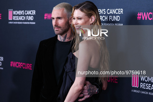 American singer and songwriter Adam Levine of American pop rock band Maroon 5 and wife/Namibian model Behati Prinsloo arrive at The Women's...