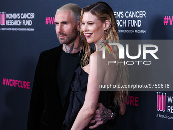 American singer and songwriter Adam Levine of American pop rock band Maroon 5 and wife/Namibian model Behati Prinsloo arrive at The Women's...