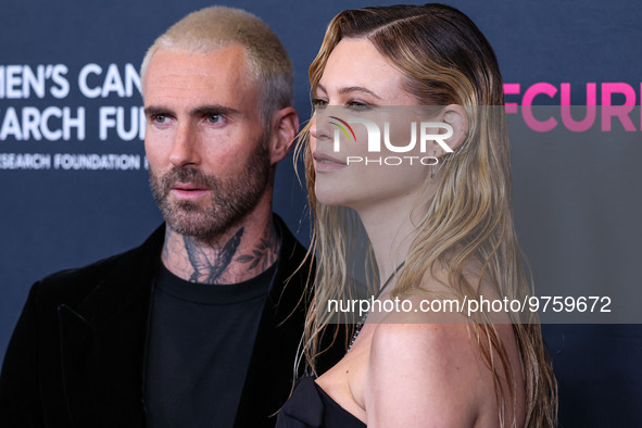 American singer and songwriter Adam Levine of American pop rock band Maroon 5 and wife/Namibian model Behati Prinsloo arrive at The Women's...