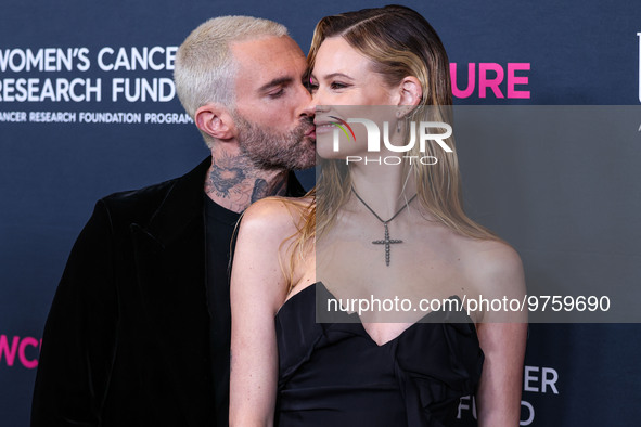 American singer and songwriter Adam Levine of American pop rock band Maroon 5 and wife/Namibian model Behati Prinsloo arrive at The Women's...