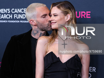 American singer and songwriter Adam Levine of American pop rock band Maroon 5 and wife/Namibian model Behati Prinsloo arrive at The Women's...