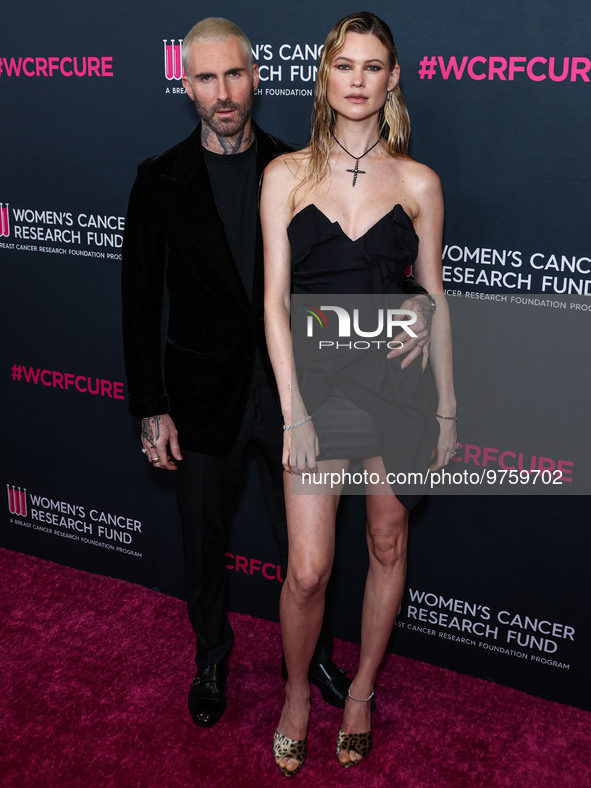 American singer and songwriter Adam Levine of American pop rock band Maroon 5 and wife/Namibian model Behati Prinsloo arrive at The Women's...