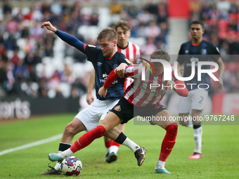 Sunderland's Dan Neil wins the ball from Luton Town's Luke Berry during the Sky Bet Championship match between Sunderland and Luton Town at...