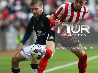 Sunderland's Dan Neil battles with Luton Town's Luke Berry during the Sky Bet Championship match between Sunderland and Luton Town at the St...