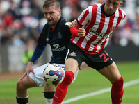 Sunderland's Dan Neil battles with Luton Town's Luke Berry during the Sky Bet Championship match between Sunderland and Luton Town at the St...