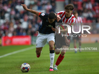 Sunderland's Edouard Michut challanges Luton Town's Cody Drameh during the Sky Bet Championship match between Sunderland and Luton Town at t...