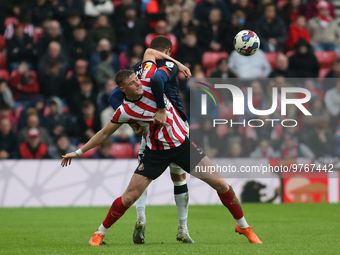 Sunderland's Daniel Ballard challenges Luton Town's Carlton Morris during the Sky Bet Championship match between Sunderland and Luton Town a...