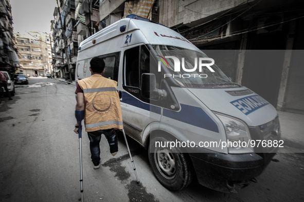 Nour, a 18-year-old Syrian man, rides an ambulance, in a rebel-controlled area of Aleppo, on December 29, 2015. Nour lost his leg following...