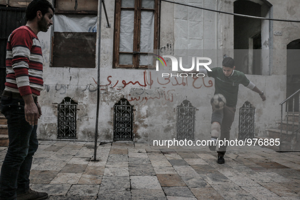 Playing football with his friends in the Syrian civil defense in a rebel-controlled area Bab alnyrab of Aleppo, on December 29, 2015 .Nour l...