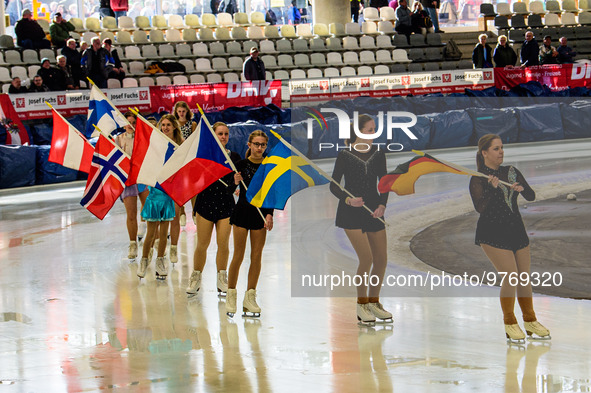 The skating club based at the Arena skate around the track with the flags of nations competing during the Ice Speedway Gladiators World Cham...