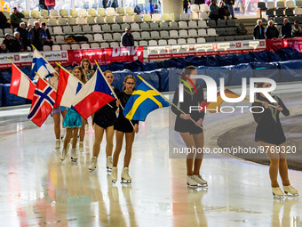 The skating club based at the Arena skate around the track with the flags of nations competing during the Ice Speedway Gladiators World Cham...