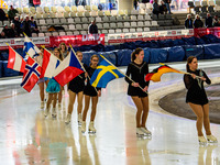 The skating club based at the Arena skate around the track with the flags of nations competing during the Ice Speedway Gladiators World Cham...