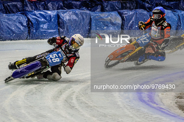 Stefan Svensson (58) (White) leads Lukas Hutla (212) (Blue) who appears to have hit a rut during the Ice Speedway Gladiators World Champions...