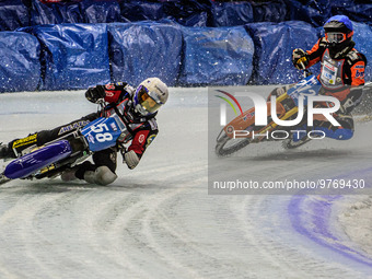 Stefan Svensson (58) (White) leads Lukas Hutla (212) (Blue) who appears to have hit a rut during the Ice Speedway Gladiators World Champions...