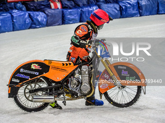 Lukas Hutla (212) walks his bike off the track after his fall during the Ice Speedway Gladiators World Championship Final 1 at Max-Aicher-Ar...