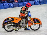 Lukas Hutla (212) walks his bike off the track after his fall during the Ice Speedway Gladiators World Championship Final 1 at Max-Aicher-Ar...