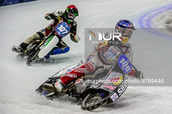 Franz Zorn (100) (Blue) leads Andrej Divis (107) (Red) during the Ice Speedway Gladiators World Championship Final 1 at Max-Aicher-Arena, In...